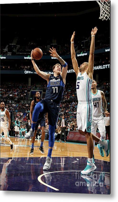 Luka Doncic Metal Print featuring the photograph Dallas Mavericks V Charlotte Hornets by Brock Williams-smith