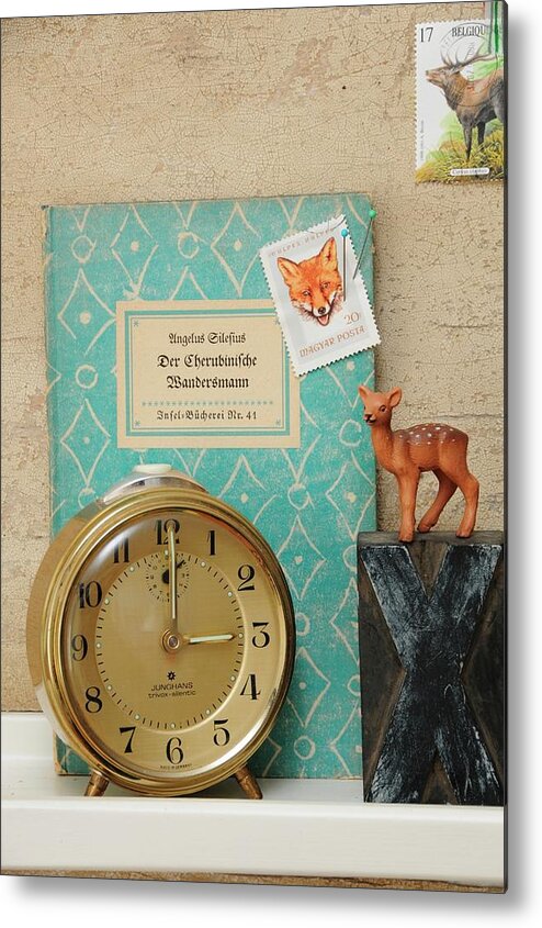 Ip_11217176 Metal Print featuring the photograph Vintage Ornaments On Bookshelf; Animal-motif Postage Stamps, Decorative Book Cover, Toy Deer, X And 8 Printing Blocks And 60s Junghans Alarm Clock #1 by Revier 51