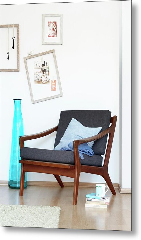 Ip_11003031 Metal Print featuring the photograph 60s Armchair In Danish Design Next To A Blue Floor Vase And Pictures On The Wall by Franziska Taube