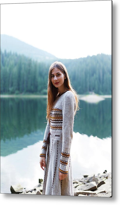 Woman Metal Print featuring the photograph Woman In A Dress Near The Lake In The Forest In The Mountains #9 by Cavan Images / Orest Filin