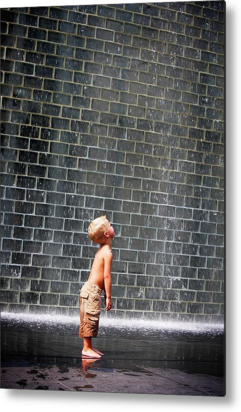 4-5 Years Metal Print featuring the photograph A Boy Standing Beside A Wall Fountain by Design Pics