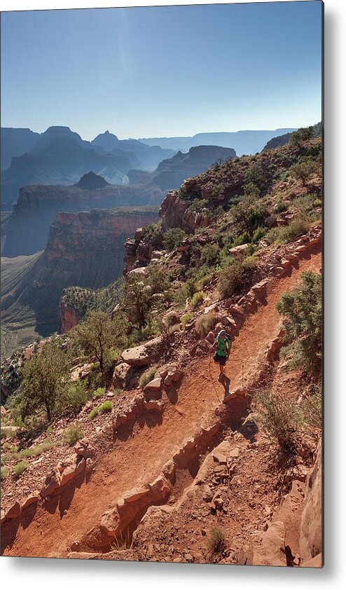 Tranquility Metal Print featuring the photograph A Man Hiking On A Trail With Canyons In by Whit Richardson