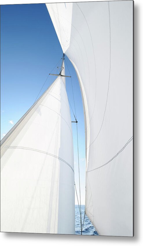 Curve Metal Print featuring the photograph A White Sail Being Blown By The Wind by Nikitje