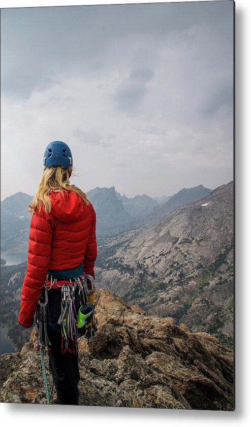 Hiker Metal Print featuring the photograph Female Hiker With Mountain Climbing Equipment Looking At View While Standing On Cliff Against Sky by Cavan Images