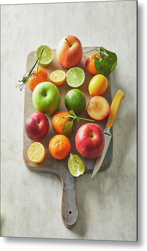 Cuisine At Home Metal Print featuring the photograph Fruit on a cutting board by Cuisine at Home