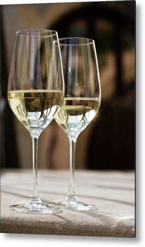 Alcohol Metal Print featuring the photograph Glasses Of White Wine On Table by Foodcollection Rf