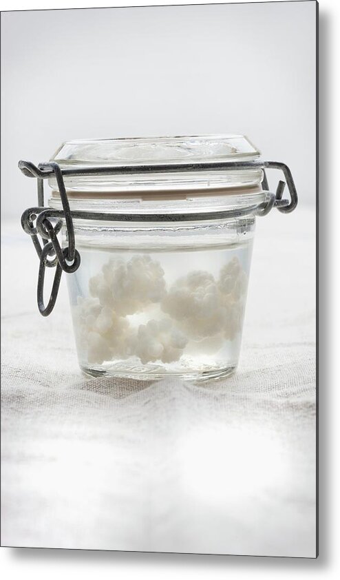 Ip_11285684 Metal Print featuring the photograph Kefir Grains In A Closed Glass Container Of Water by Sabine Lscher