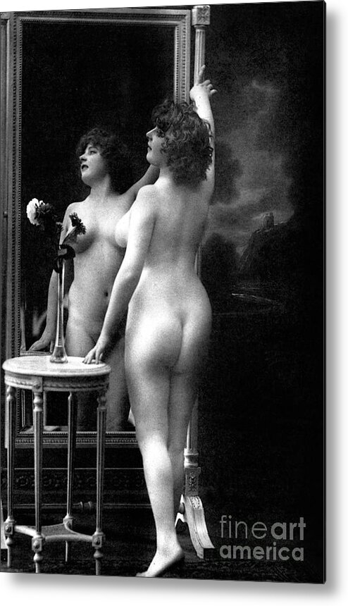 Mirror Metal Print featuring the photograph Naked woman posing in front of a mirror near a pedestal table, 1913 by French School