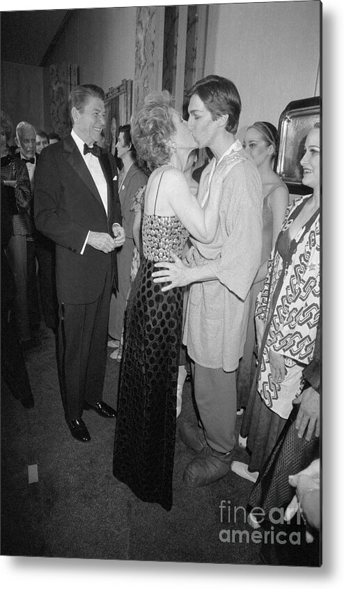 Following Metal Print featuring the photograph Nancy Reagan Kissing Son After Dance by Bettmann