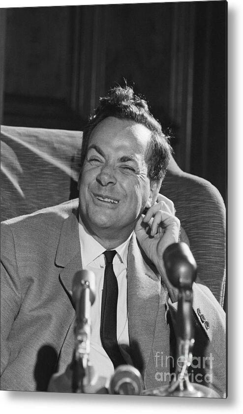 Physicist Metal Print featuring the photograph Richard Feynman Seated Smiling by Bettmann