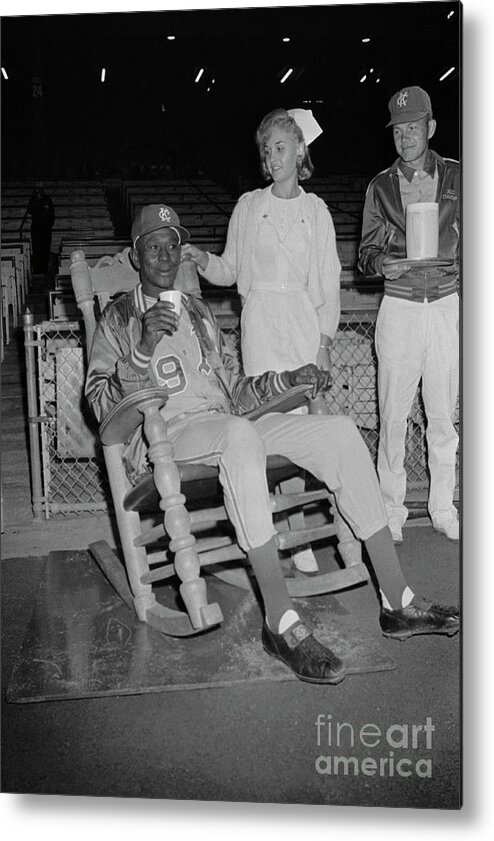 1980-1989 Metal Print featuring the photograph Satchel Paige Sitting On A Chair by Bettmann