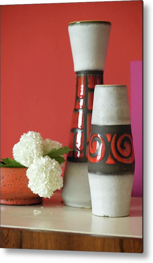 Ip_11037421 Metal Print featuring the photograph Set Of 70s-style Vases And White Carnations In Bowl Against Red-painted Wall by Winfried Heinze
