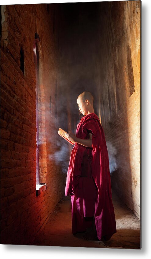 Tranquility Metal Print featuring the photograph Young Buddhist Monk Reading In Pagoda by Peter Adams