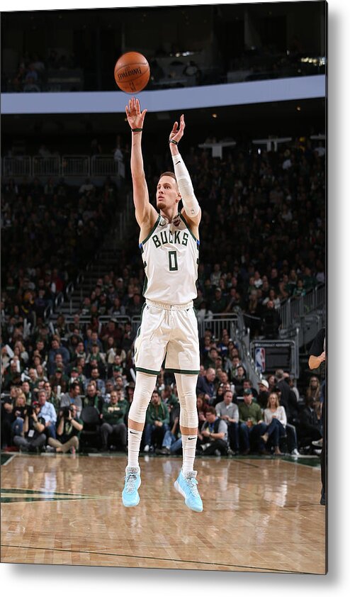 Donte Divincenzo Metal Print featuring the photograph New York Knicks v Milwaukee Bucks #11 by Gary Dineen