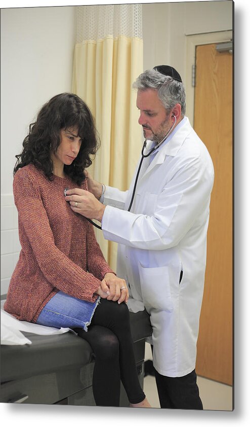 Expertise Metal Print featuring the photograph Doctor Examining Patient #2 by Wendy Connett