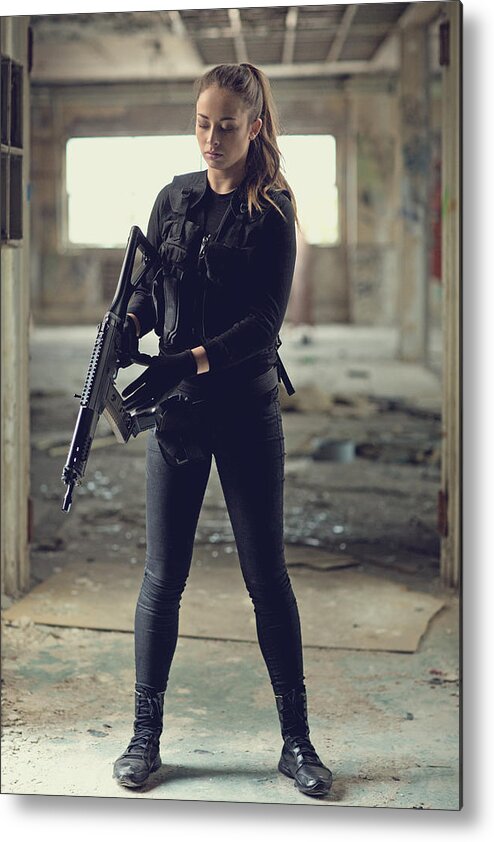 Expertise Metal Print featuring the photograph Female military swat team member holding rifle in abandoned warehouse #3 by Lorado