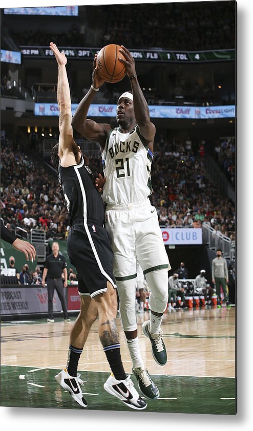 Jrue Holiday Metal Print featuring the photograph Jrue Holiday #4 by Gary Dineen