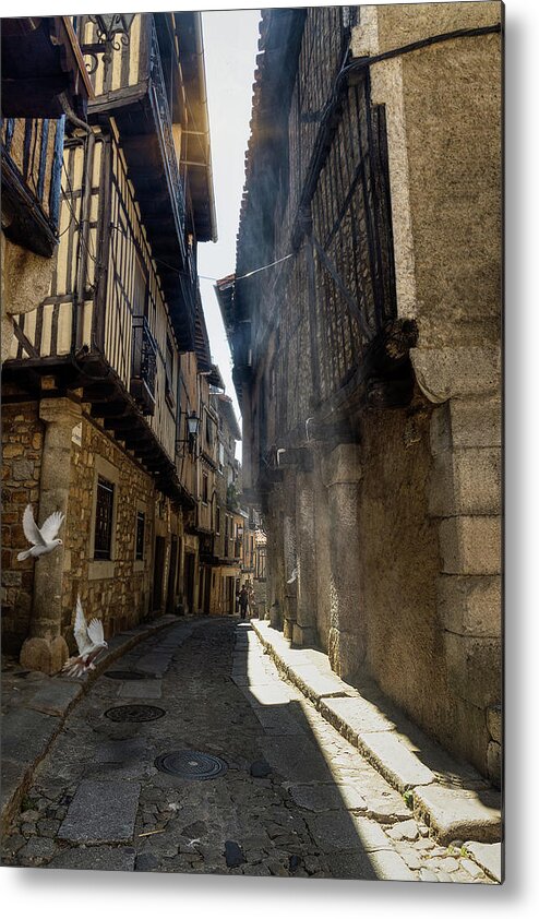 La Alberca Metal Print featuring the photograph A blade of sunshine in the alley by Micah Offman