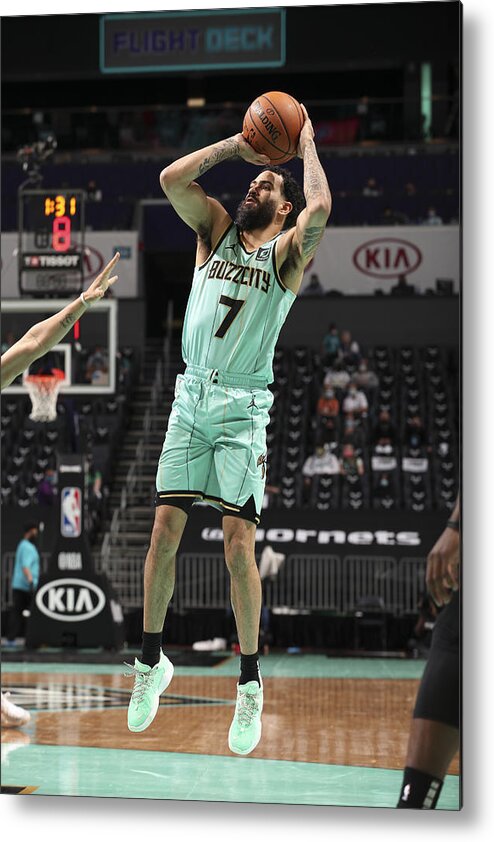 Grant Riller Metal Print featuring the photograph Boston Celtics v Charlotte Hornets by Kent Smith