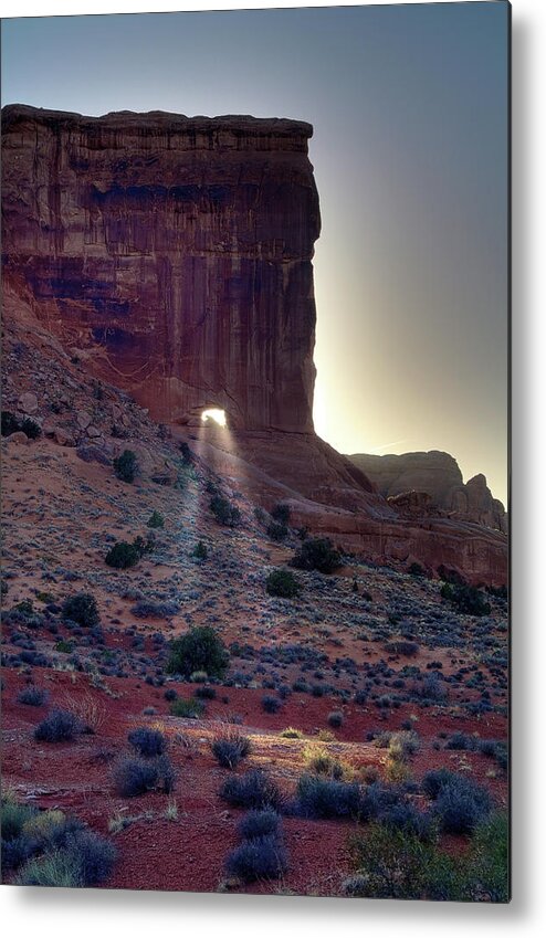  Park Avenue Metal Print featuring the photograph Let your Light Shine Through - Sun beaming through portal in Sheep Rock at Arches National Park by Peter Herman