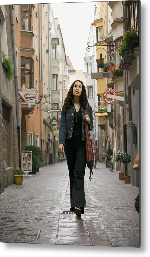 Looking Metal Print featuring the photograph Lifestyle Portrait Of A Young Adult Woman As She Goes Sightseeing While Visiting Europe by Photodisc