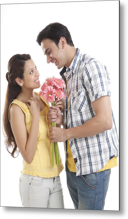 Young Men Metal Print featuring the photograph Man giving flowers to woman by Ravi Ranjan