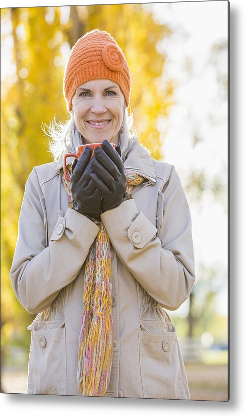 Provo Metal Print featuring the photograph Older Caucasian woman drinking coffee near autumn trees by Mike Kemp