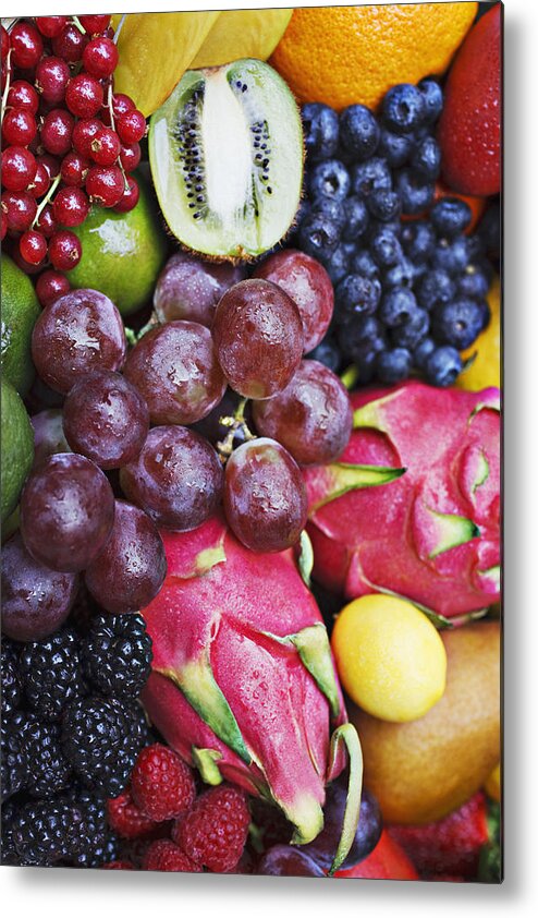 Orange Color Metal Print featuring the photograph Variety of vibrant fruit by Tom Merton