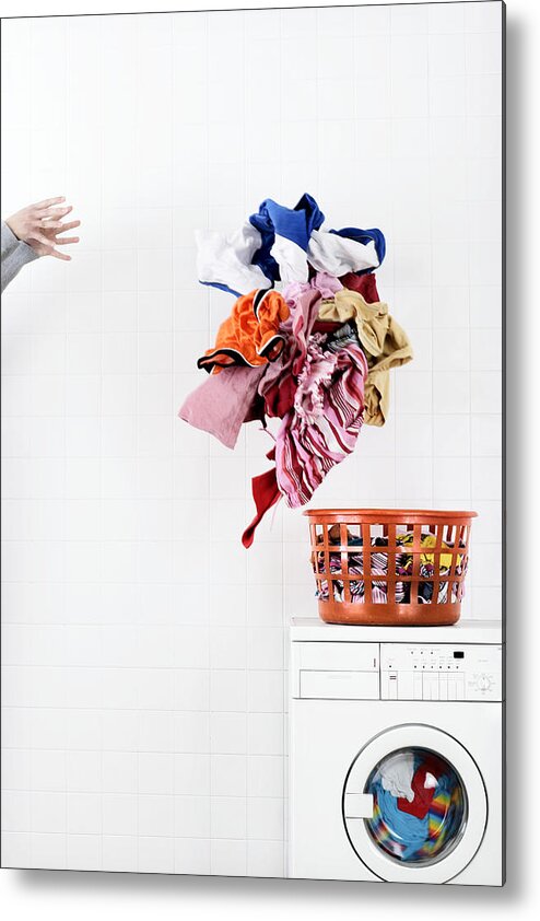 White People Metal Print featuring the photograph Woman throwing pile of laundry to basket on washing machine by Martin Poole