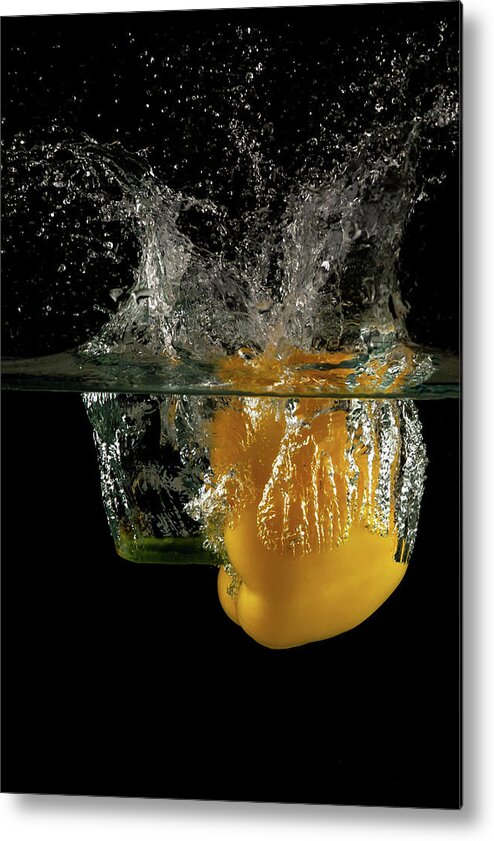 Pepper Metal Print featuring the photograph Yellow bell pepper dropped and slashing on water by Michalakis Ppalis