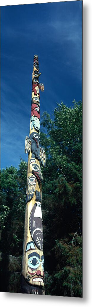 Photography Metal Print featuring the photograph Low Angle View Of A Totem Pole, Totem by Panoramic Images