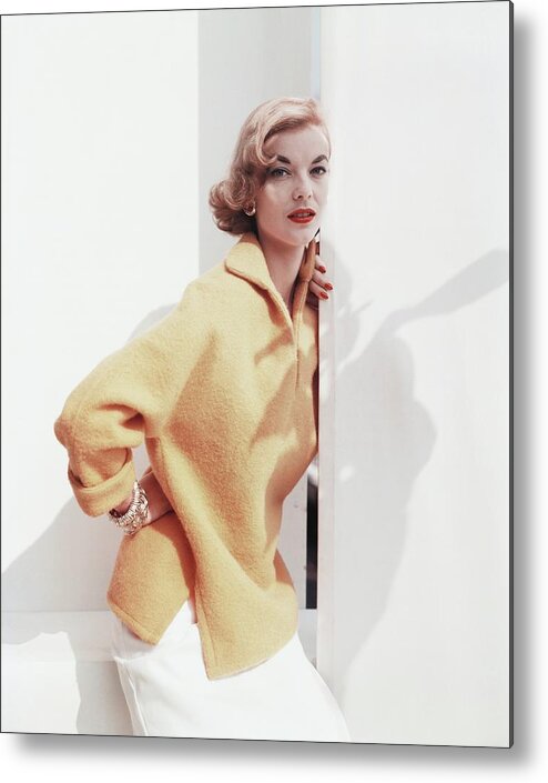 Studio Shot Metal Print featuring the photograph Model Wearing Yellow Sweater #1 by Horst P. Horst