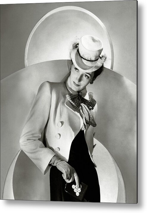 Coin Purse Metal Print featuring the photograph A Model Wearing A Jacket And Hat by Horst P. Horst