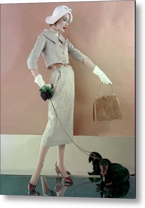 Fashion Metal Print featuring the photograph A Model Wearing A Tweed Jacket And Skirt by Karen Radkai