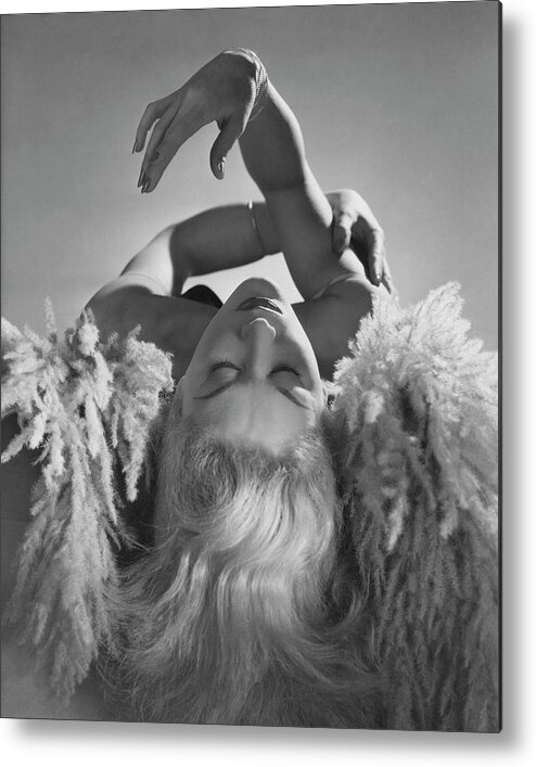 One Person Metal Print featuring the photograph A Portrait Of Lisa Fonssagrives Lying by Horst P. Horst