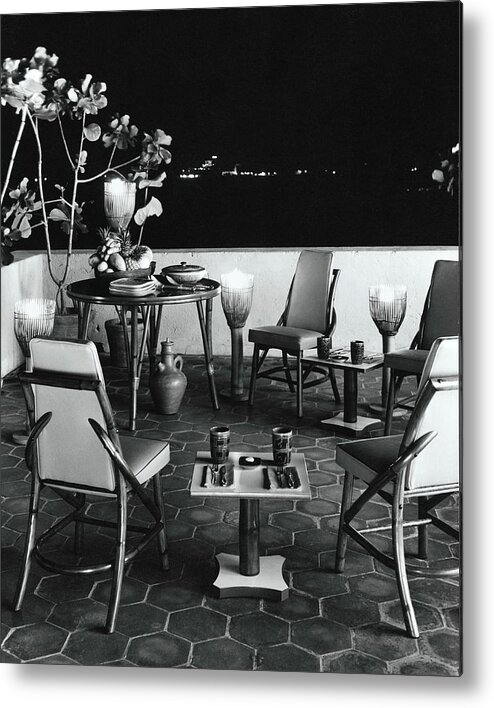 Dining Table Metal Print featuring the photograph A Rattan Dining Set On A City Terrace by Tom Leonard