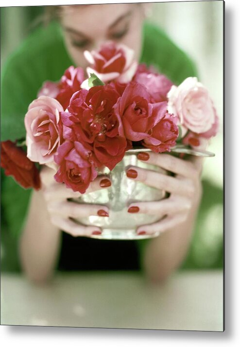 Flowers Metal Print featuring the photograph A Woman Holding A Bowl Of Roses by John Rawlings