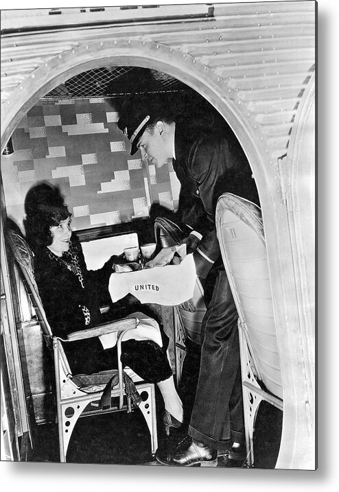 1928 Metal Print featuring the photograph Airline Steward Serves Woman by Underwood Archives