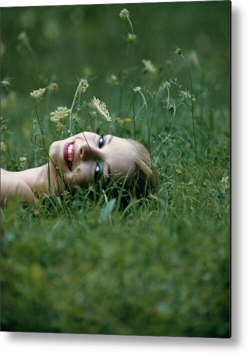 One Person Metal Print featuring the photograph Model Gretchen Harris Lying In A Field by Karen Radkai