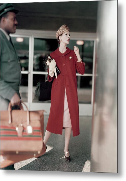 Full-length Metal Print featuring the photograph Model In A Red Coat At The Airport by Karen Radkai