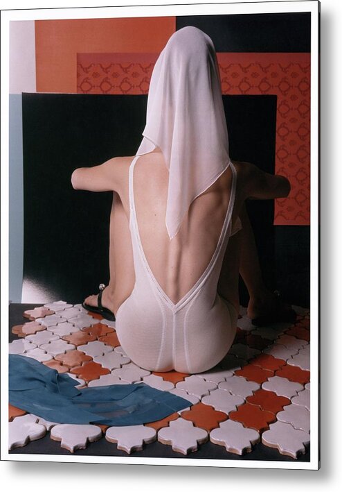 Studio Shot Metal Print featuring the photograph Model With Scarf Over Her Head Wearing Bodysuit by Horst P. Horst