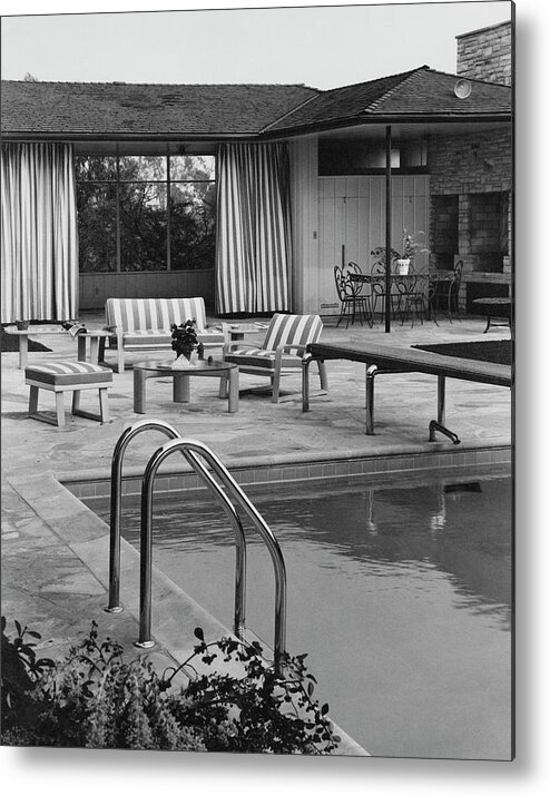 Architecture Metal Print featuring the photograph The Pool And Pavilion Of A House by Sharland 