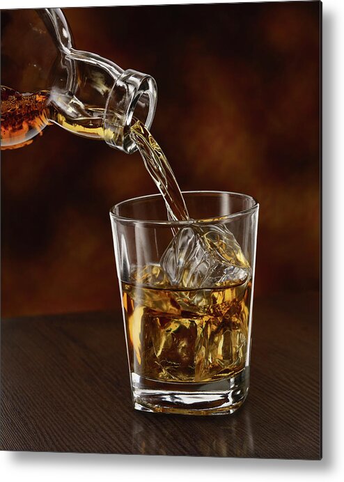 Alcohol Metal Print featuring the photograph Whisky Being Poured In A Tumbler, Close by Westend61