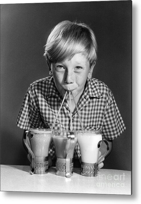 1950s Metal Print featuring the photograph Boy Drinking Three Shakes At Once by Debrocke/ClassicStock