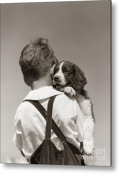 1930s Metal Print featuring the photograph Boy With Puppy, C.1930-40s by H Armstrong Roberts ClassicStock