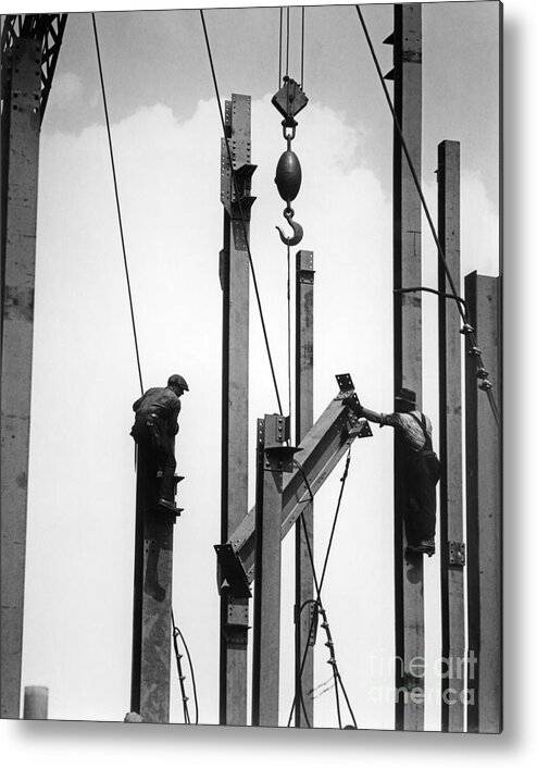 1930s Metal Print featuring the photograph Construction Workers Raising Steel by H. Armstrong Roberts/ClassicStock