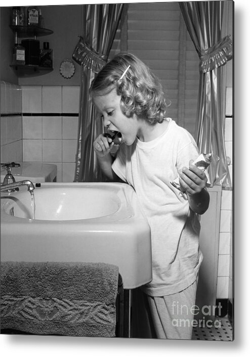 1950s Metal Print featuring the photograph Girl Brushing Her Teeth, C.1950s by E. Hibbs/ClassicStock