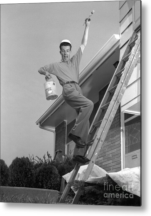 1960s Metal Print featuring the photograph Man Falling Off Ladder by H. Armstrong Roberts/ClassicStock