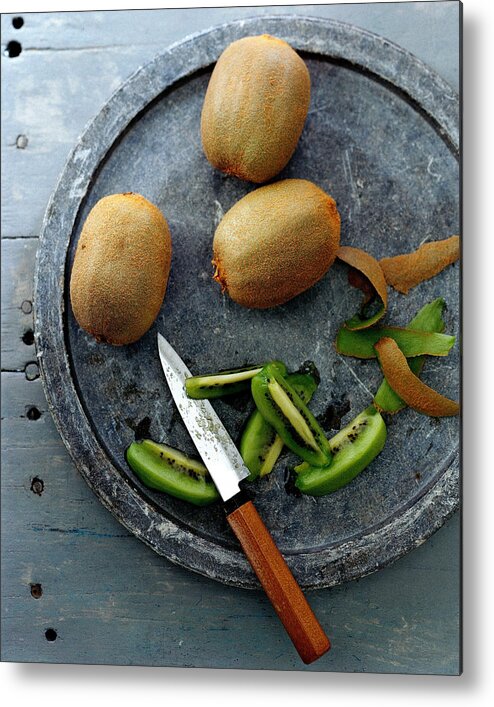 Foodstudio Shotstill Lifeplatetablewareknifekiwi Fruitfruithealthy Eatingsliceview From Above #condenastgourmetphotograph November 1st 2006 Metal Print featuring the photograph A Plate Of Kiwifuit by Romulo Yanes