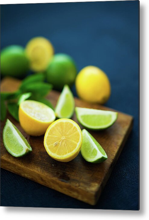 Orange Color Metal Print featuring the photograph Lemons And Limes #1 by Thepalmer